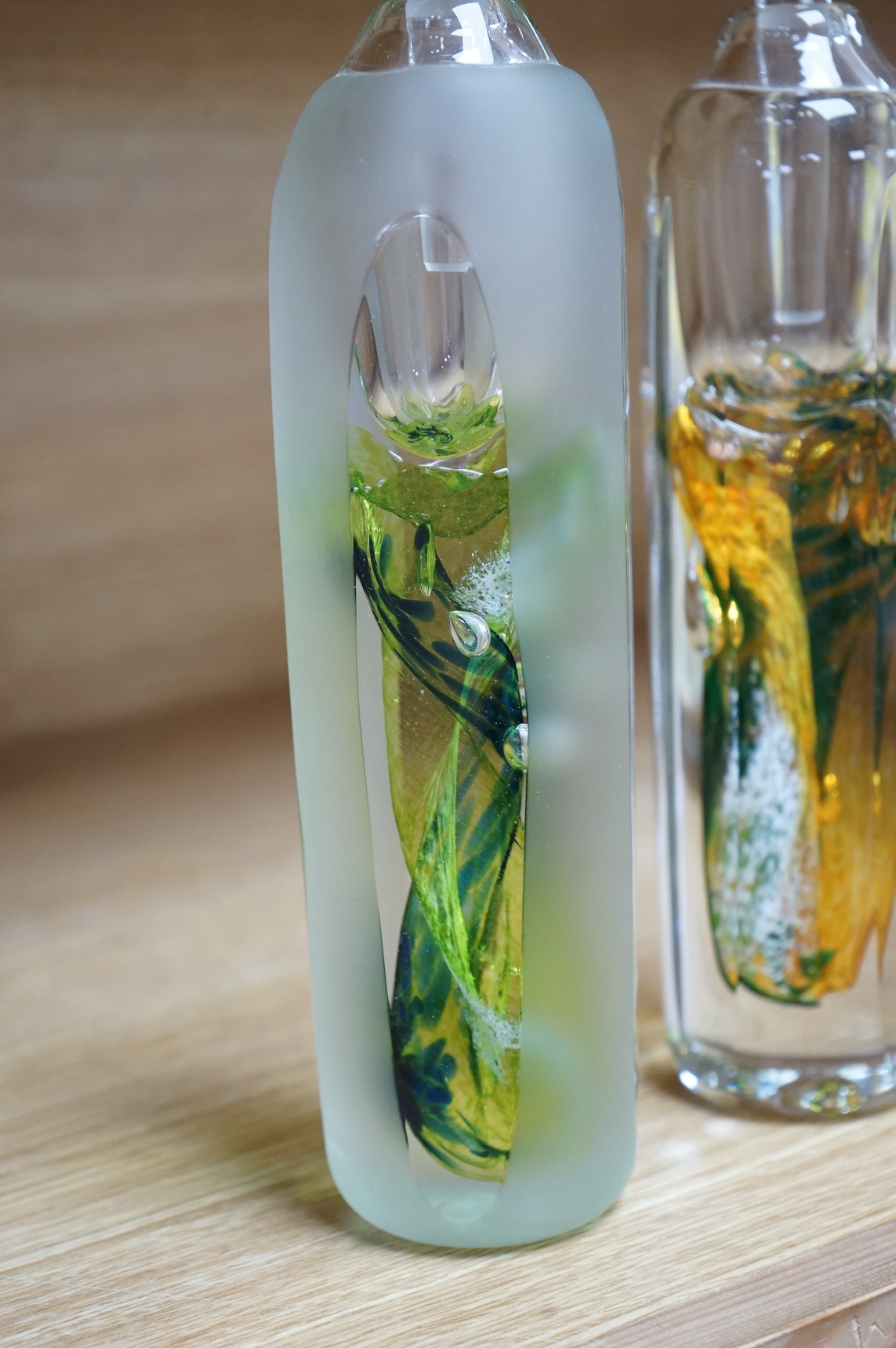 Jane Charles, two oversized art glass scent bottles and stoppers, signed to the bases, 29cm high